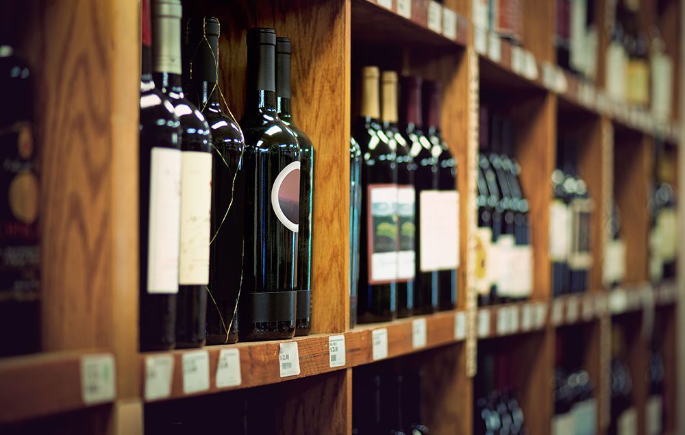 Shelf with wine bottles  