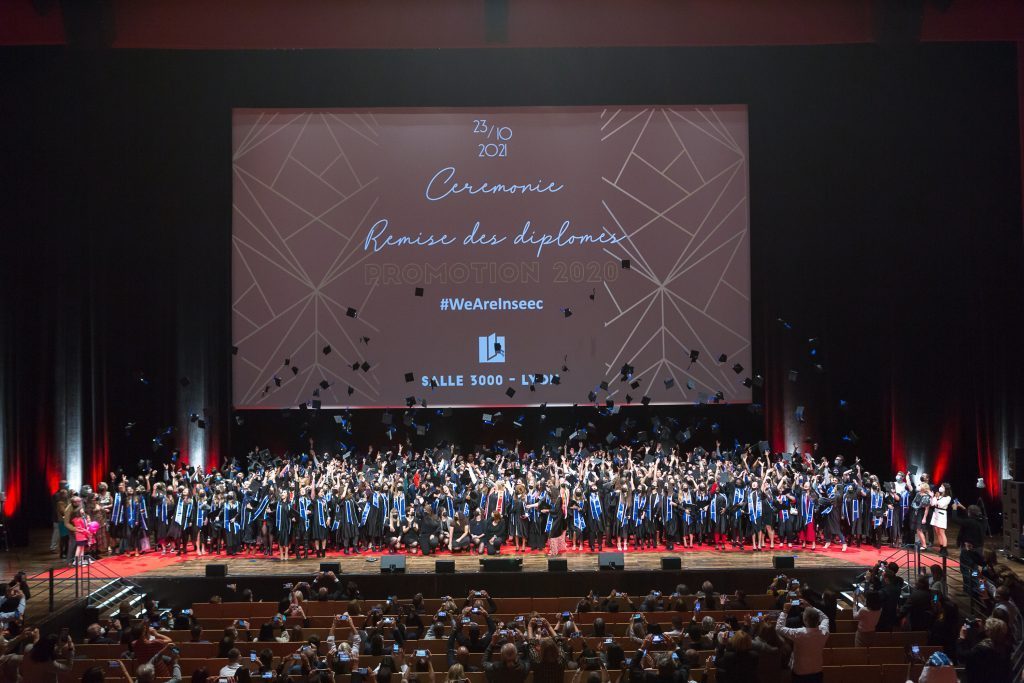 Students on stage during the graduation ceremony at Lyon MSc &amp; MBA  