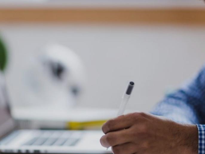 student who works in front of his computer his course of right of the establishments of health.