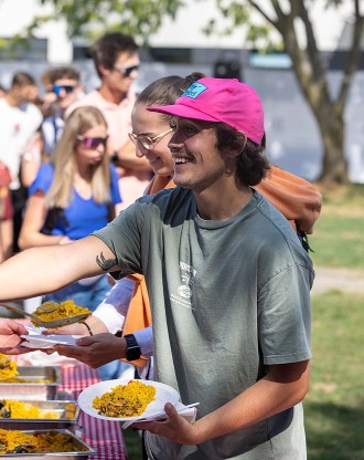 Student at an outdoor buffet organised by the INSEEC business school on its Chambéry campus