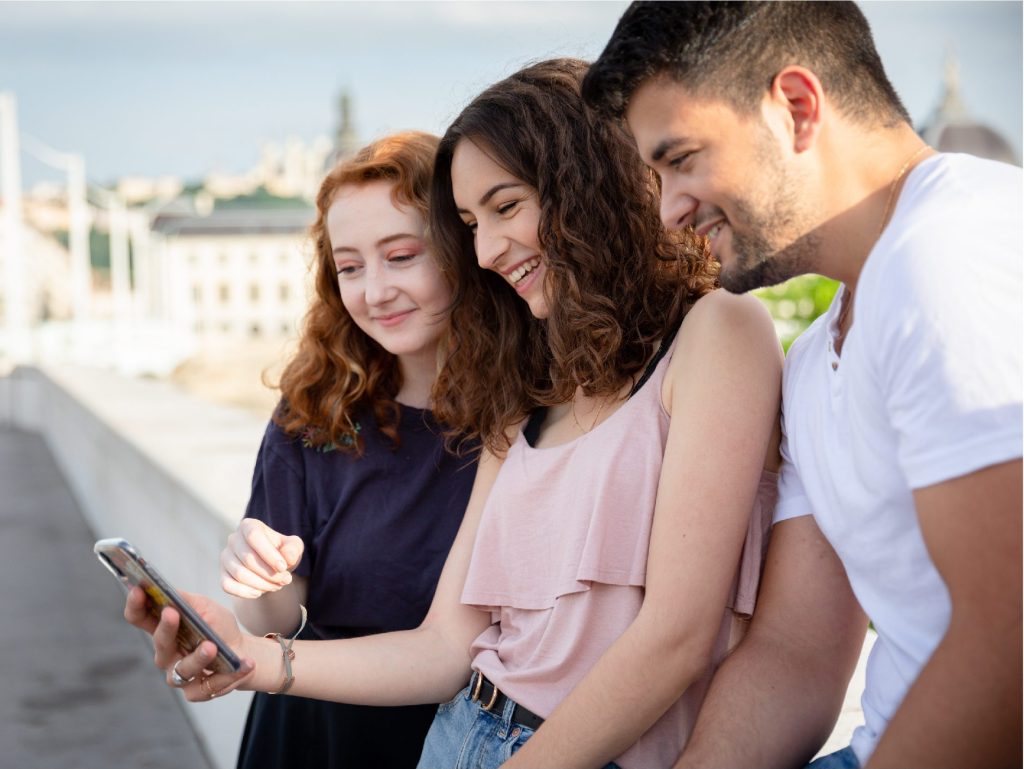 2 students looking at their phone