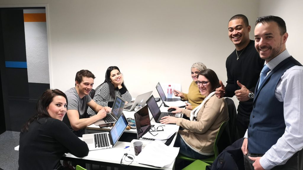 Student working in a group on a campus at INSEEC for a finance project
