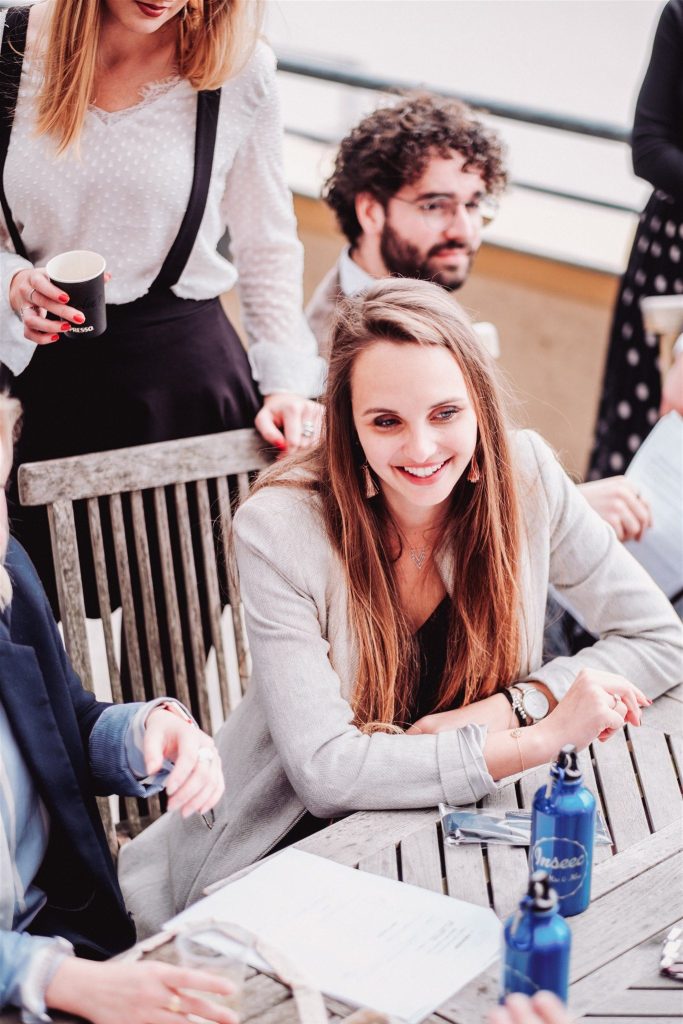 Students in human resources and health discussing on a terrace of the INSEEC school