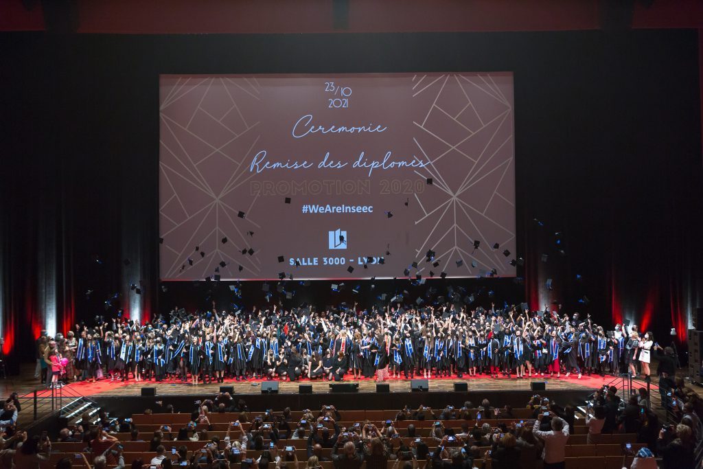 Students on stage during the graduation ceremony at Lyon MSc & MBA