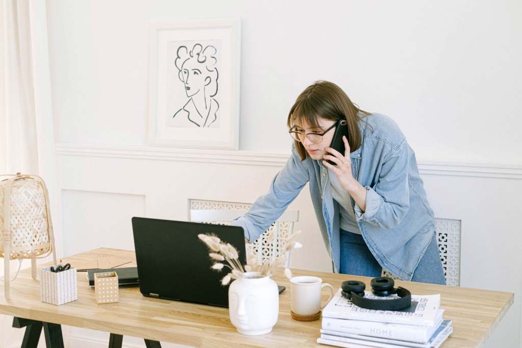 student on the phone who works in the office  