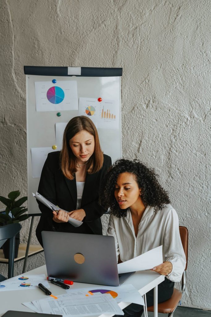 two young women working in a company