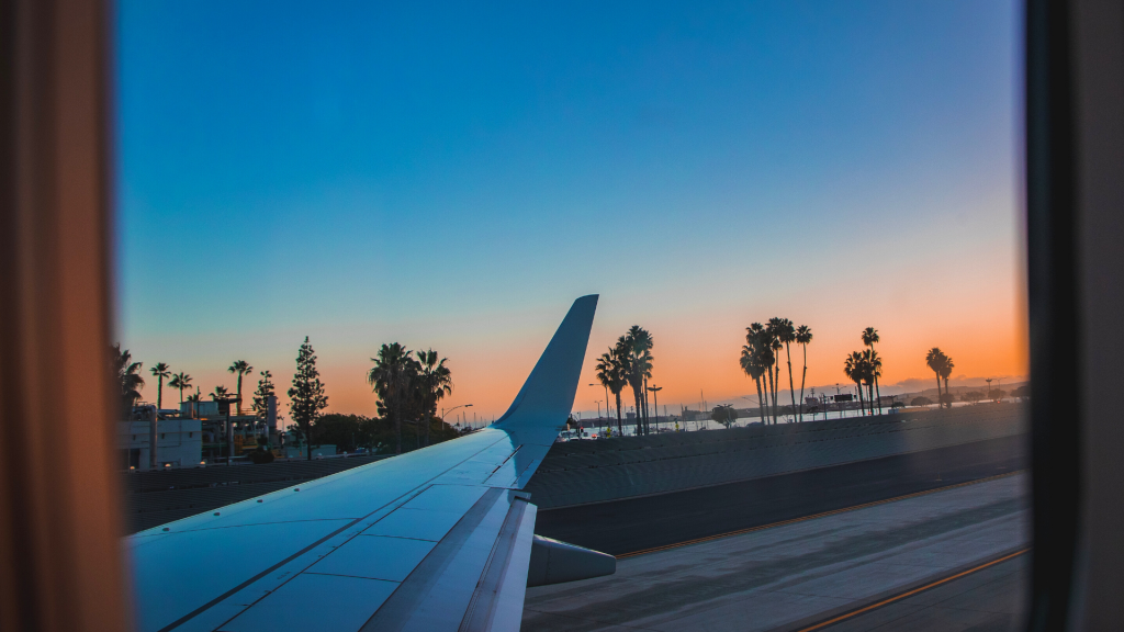 Photo taken through the window of a plane during landing  